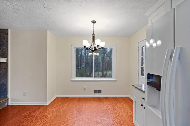 a bathroom with a sink tub and a mirror