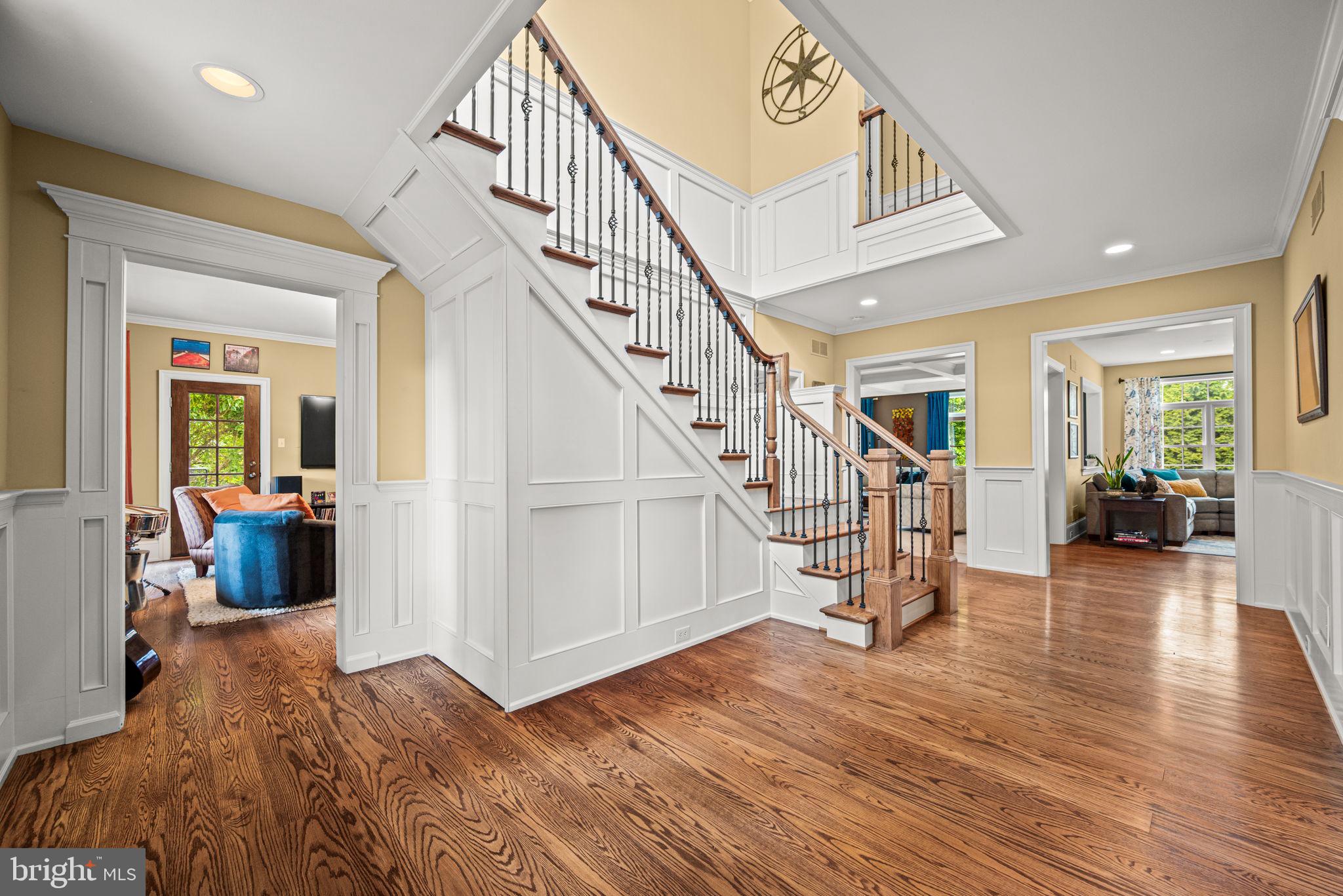 1548 Morstein Road Malvern, PA 19355 - Photo 13 of 80 a view of a livingroom with wooden floor and stairs
