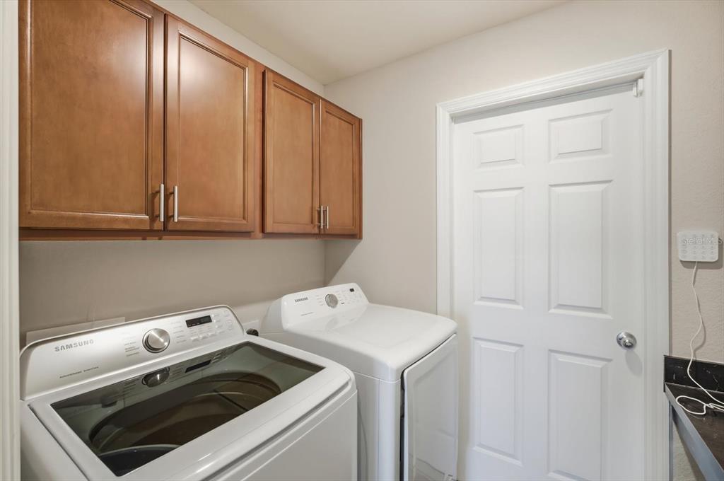 212 Serena Ridge Drive Seffner, FL 33584 - Photo 20 of 22 a utility room with dryer and washer