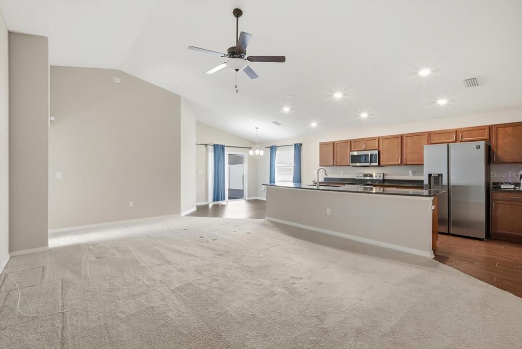 212 Serena Ridge Drive Seffner, FL 33584 - Photo 4 of 22 a view of a kitchen with refrigerator and microwave