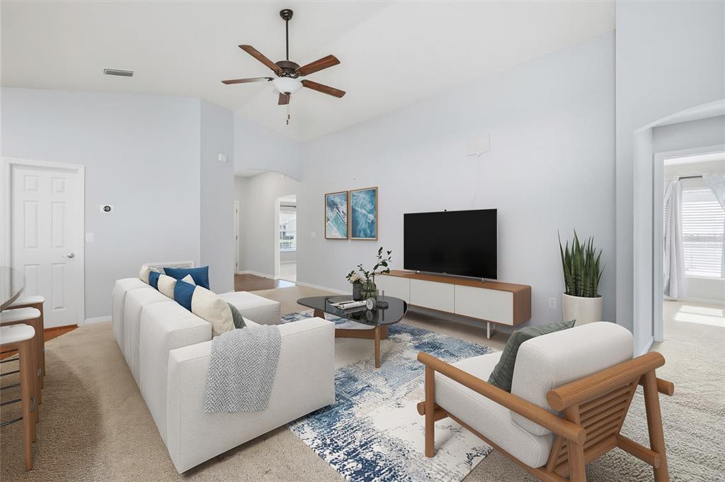 212 Serena Ridge Drive Seffner, FL 33584 - Photo 5 of 22 a living room with furniture and a flat screen tv