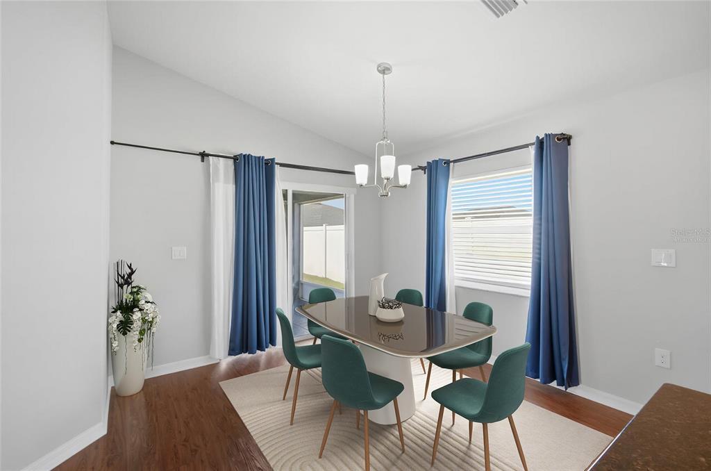 212 Serena Ridge Drive Seffner, FL 33584 - Photo 8 of 22 a view of a dining room with furniture and window