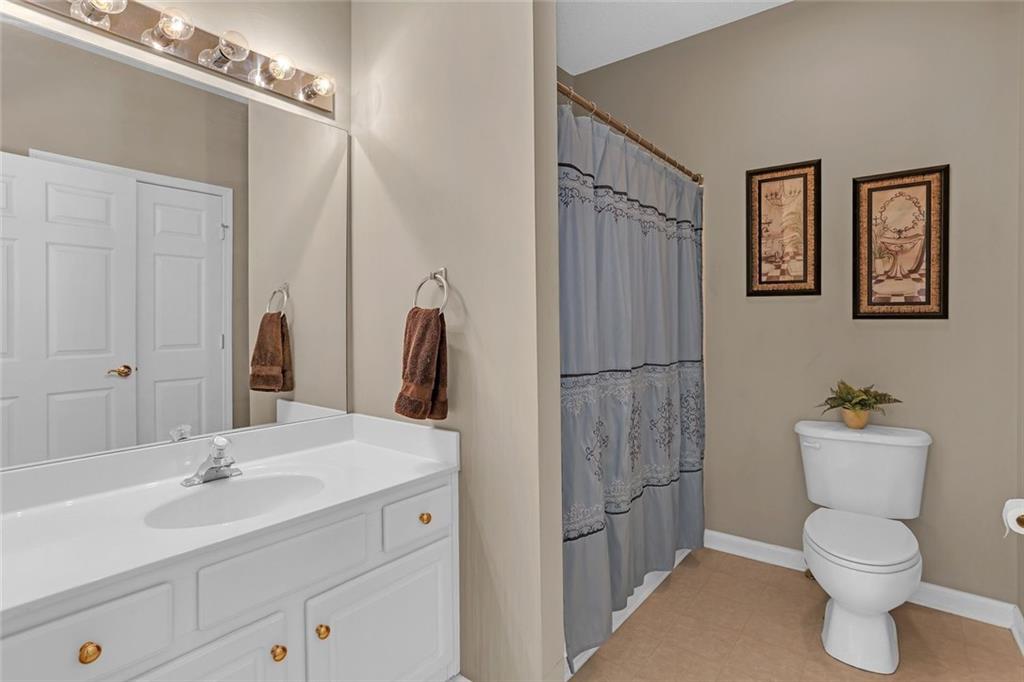 314 Gable Brook Drive Southwest Grayson, GA 30017 - Photo 12 of 26 a bathroom with a toilet sink and shower