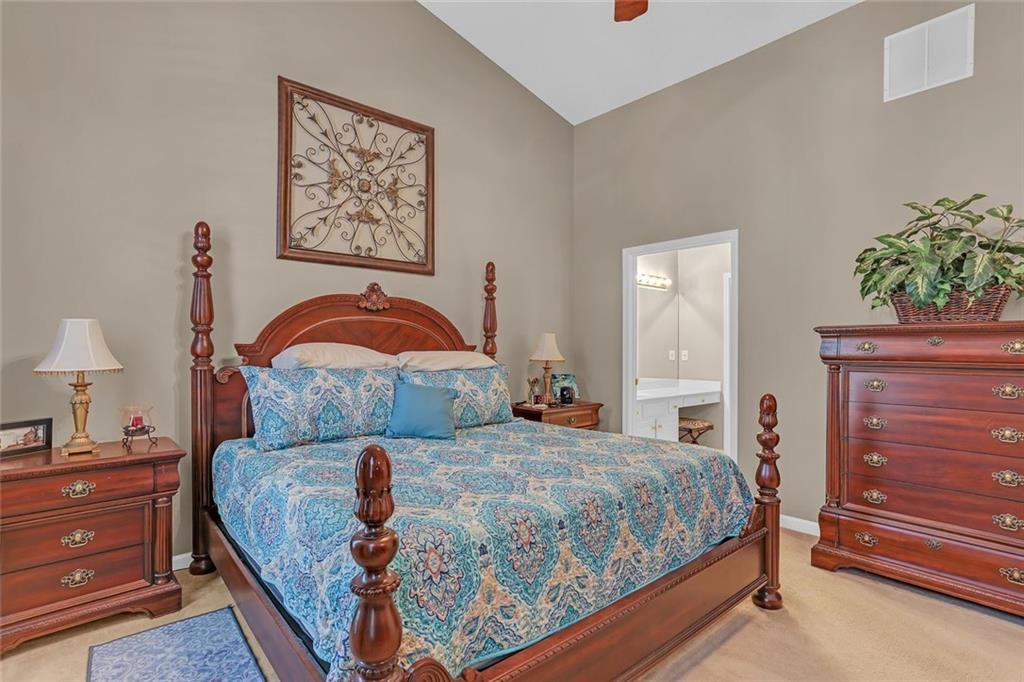 314 Gable Brook Drive Southwest Grayson, GA 30017 - Photo 17 of 26 a bedroom with a bed and a lamp on dresser