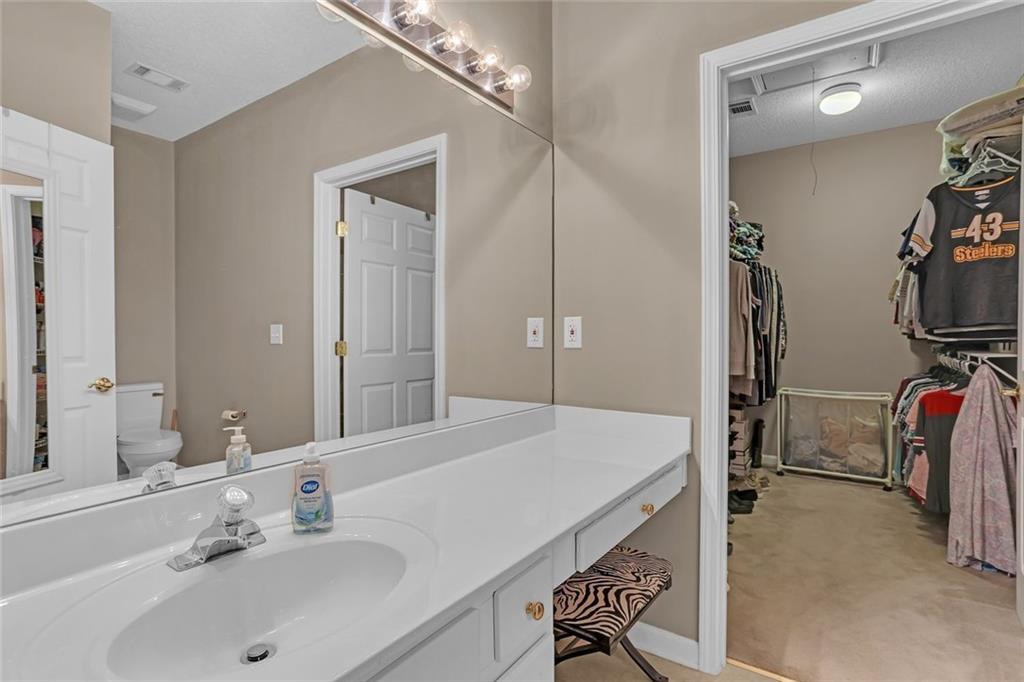 314 Gable Brook Drive Southwest Grayson, GA 30017 - Photo 18 of 26 a en suite bathroom with a double vanity sink and a mirror