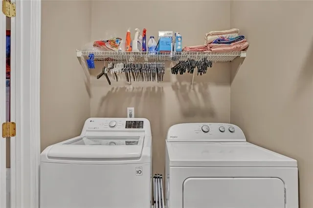 a utility room with dryer and washer
