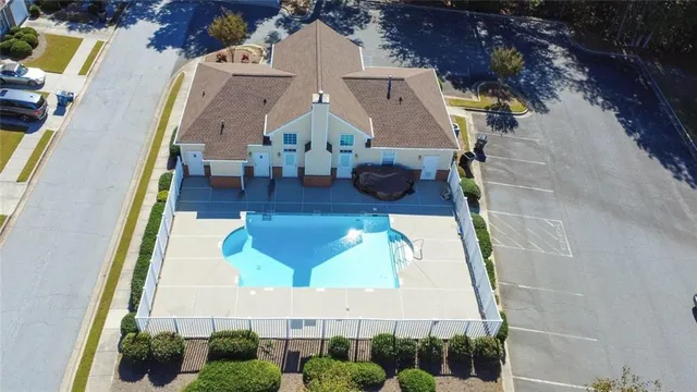 an aerial view of a house with swimming pool