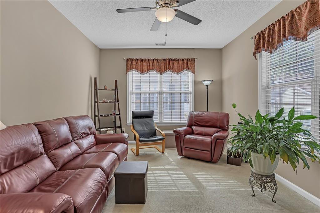 314 Gable Brook Drive Southwest Grayson, GA 30017 - Photo 8 of 26 a living room with furniture plant and a window
