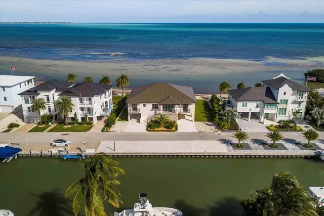 a large kitchen with stainless steel appliances double vanity and a sink