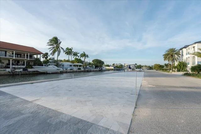 a large kitchen with stainless steel appliances granite countertop a large counter top and a stove