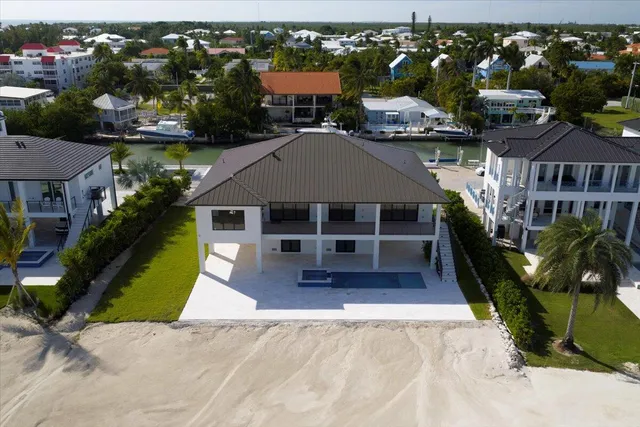 a view of a kitchen with furniture and wooden floor