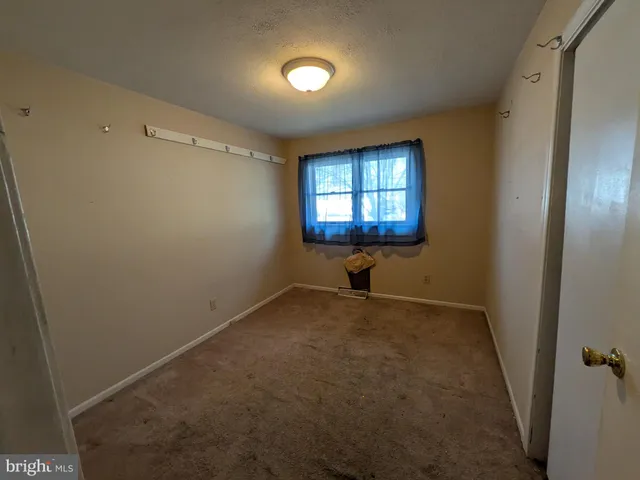 a view of empty room with windows