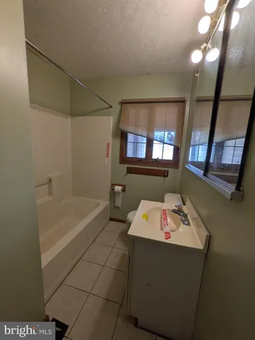 a bathroom with a sink and a bathtub