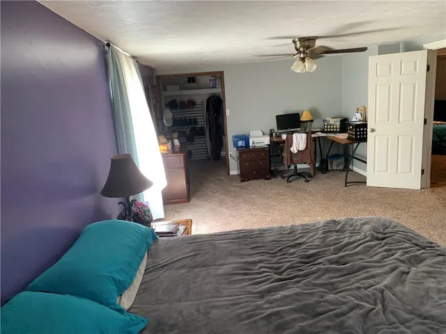 a bed room with furniture and a lamp