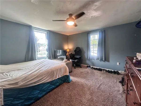 a bed room with a bed and a window