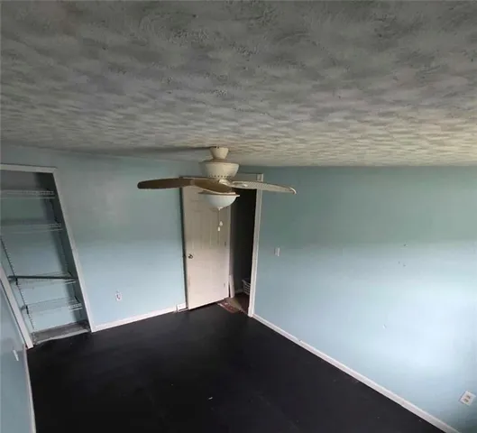 a white toilet sitting next to a bathroom sink and a tub