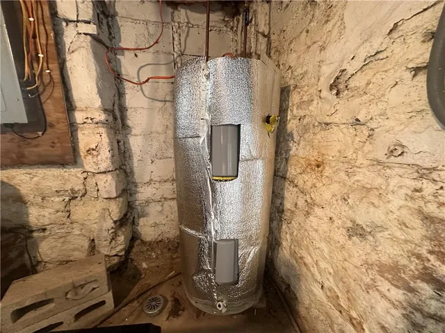 a view of a park with houses in the background