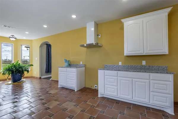 a hallway with entryway doors