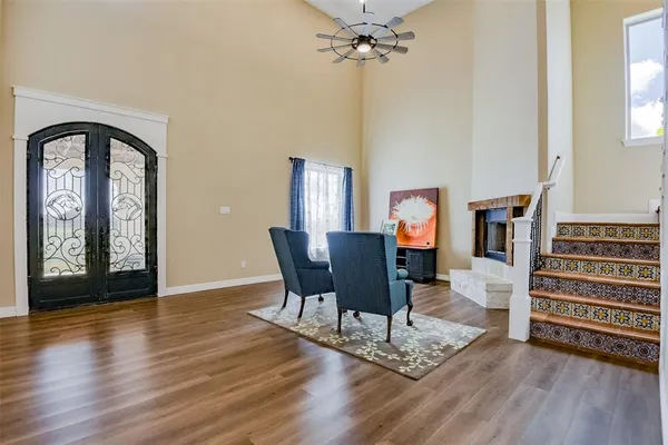 a view of a livingroom with furniture and wooden floor