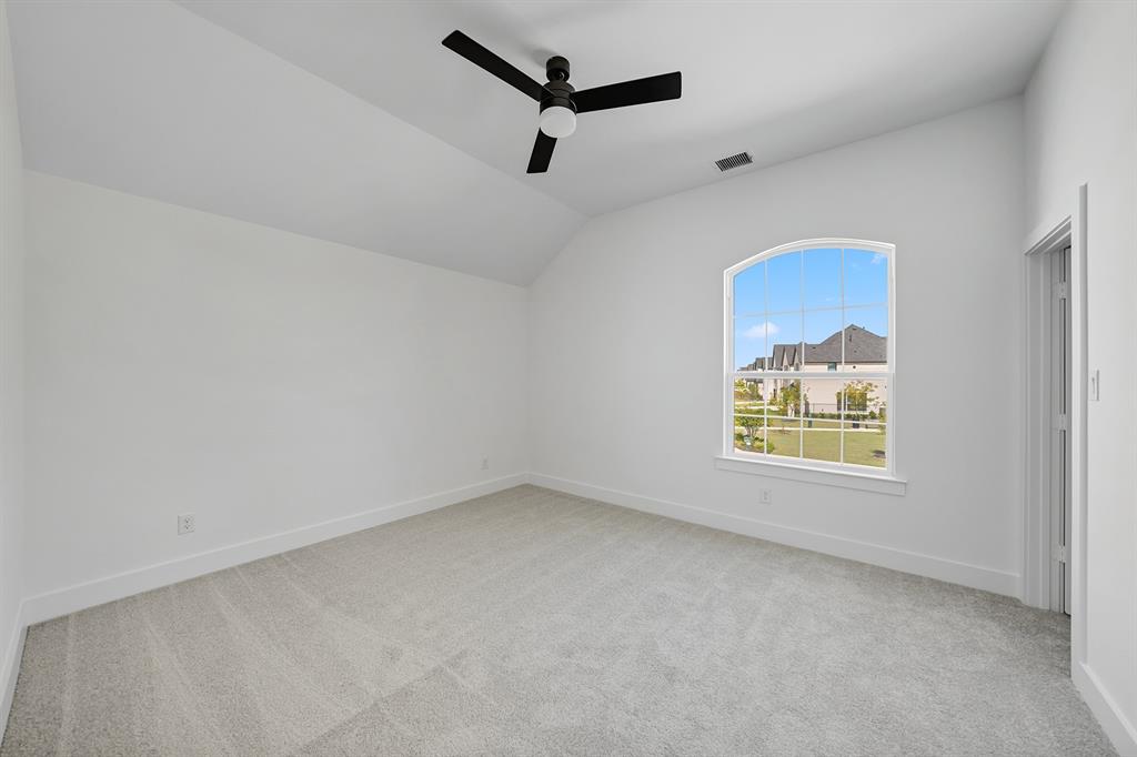 587 Mayfair Lane Frisco, TX 75033 - Photo 29 of 37 an empty room with windows and ceiling fan