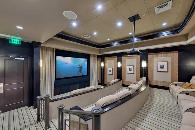 a lobby with furniture and a flat screen tv