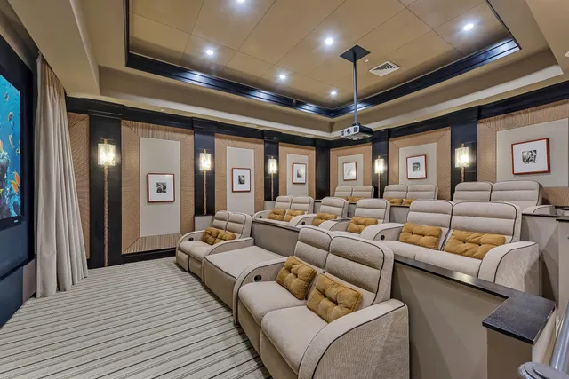 a living room with furniture a ceiling fan and a rug