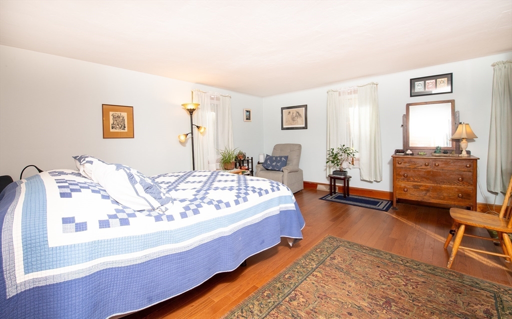 663 Wareham Street, Unit 8 Middleboro, MA 02346 - Photo 14 of 27 a bed room with a bed and a chair