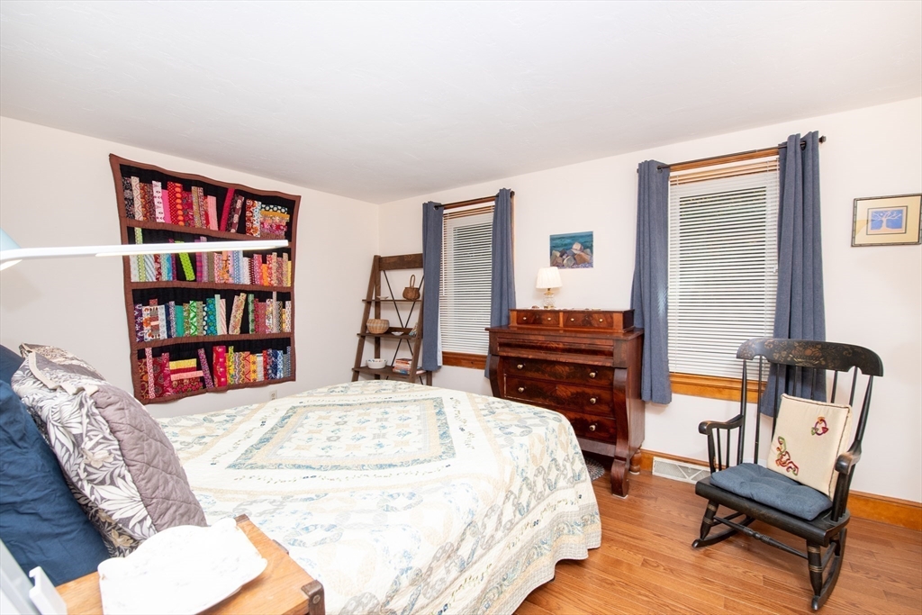 663 Wareham Street, Unit 8 Middleboro, MA 02346 - Photo 15 of 27 a living room with furniture and a book shelf