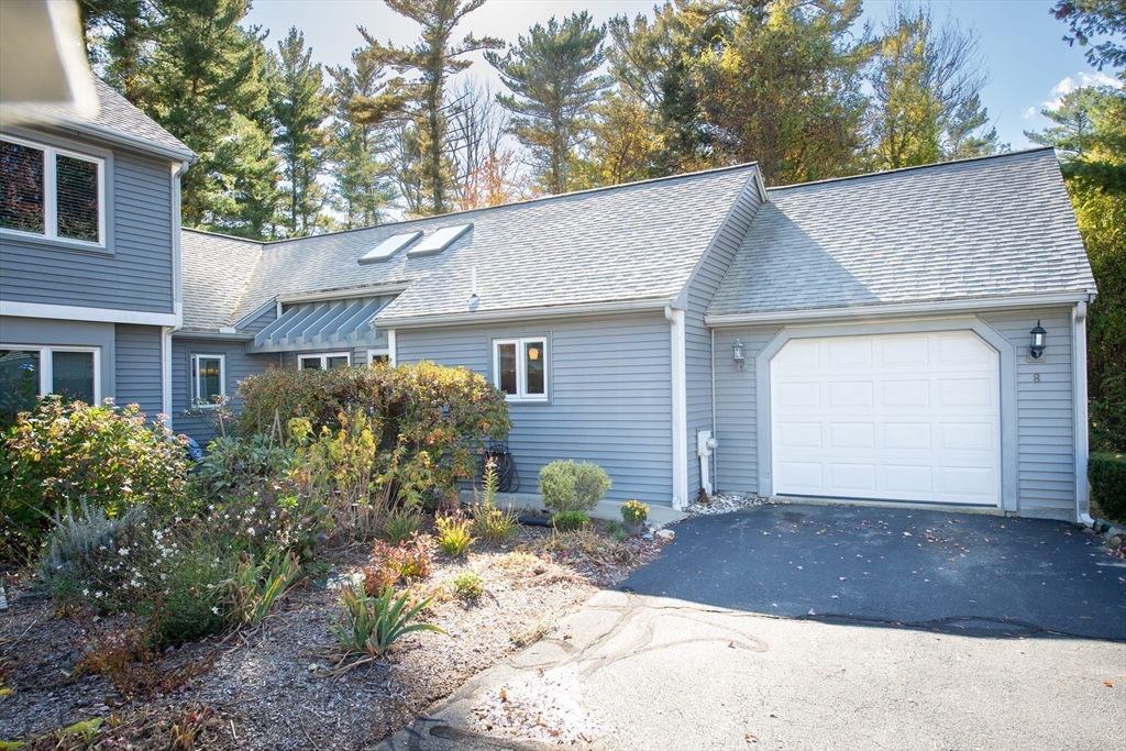 663 Wareham Street, Unit 8 Middleboro, MA 02346 - Photo 2 of 27 a front view of a house with garden