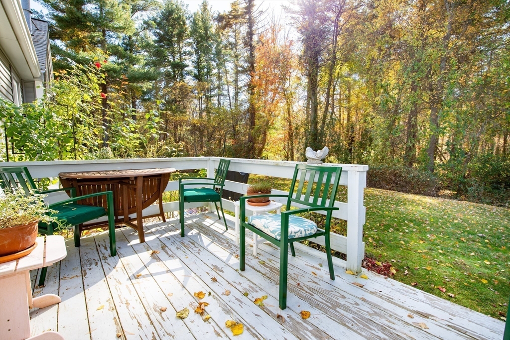 663 Wareham Street, Unit 8 Middleboro, MA 02346 - Photo 24 of 27 a view of backyard with seating space and trees