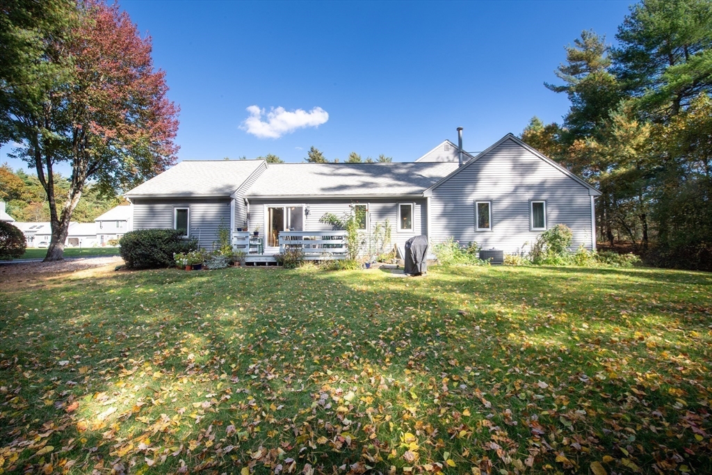 663 Wareham Street, Unit 8 Middleboro, MA 02346 - Photo 26 of 27 a front view of a house with garden