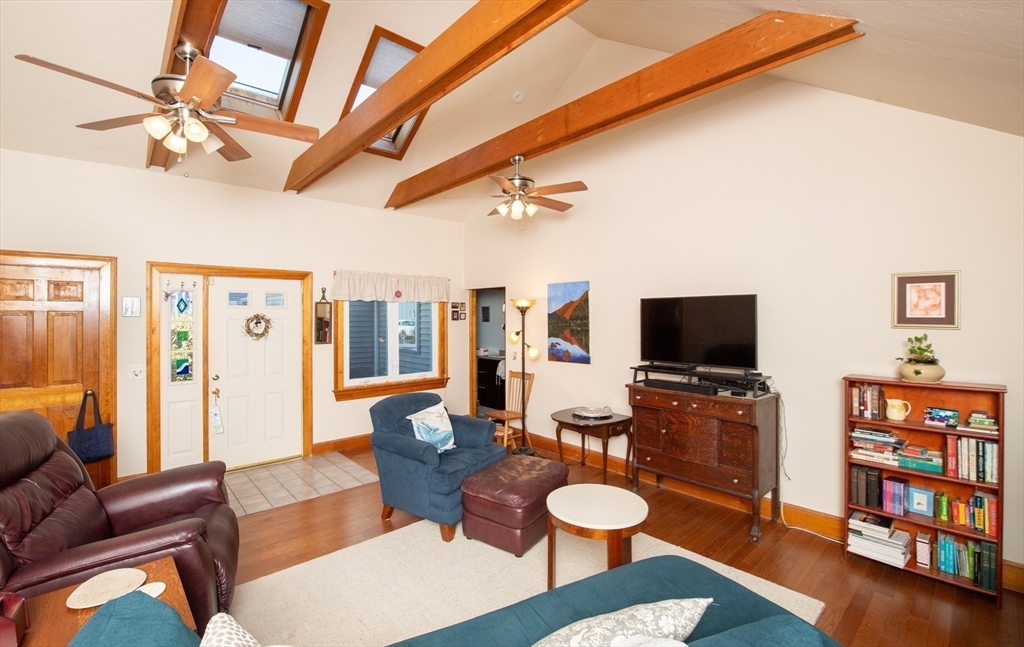 663 Wareham Street, Unit 8 Middleboro, MA 02346 - Photo 6 of 27 a living room with furniture and a flat screen tv