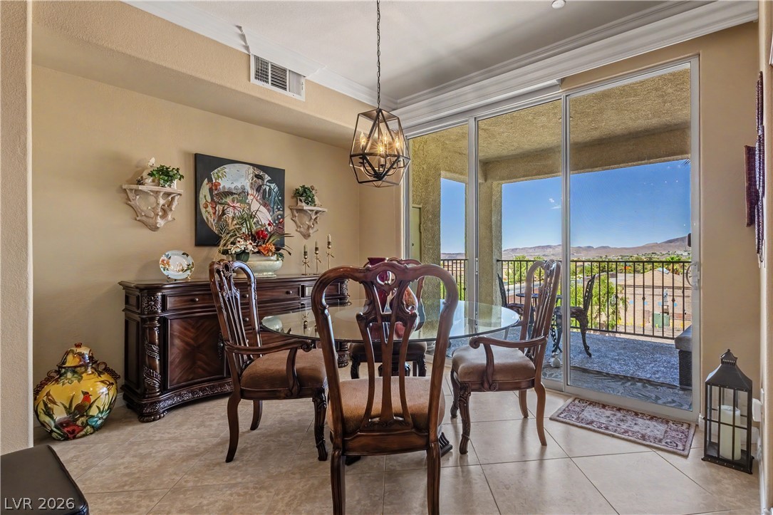 2555 Hampton Road, Unit 3308 Henderson, NV 89052 - Photo 15 of 65 Natural light floods this dining area through sliding glass doors that open to a spacious balcony with scenic views.