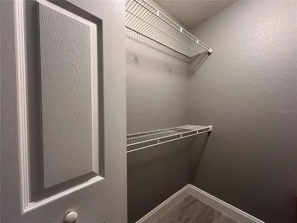 a view of a room with racks on the wall