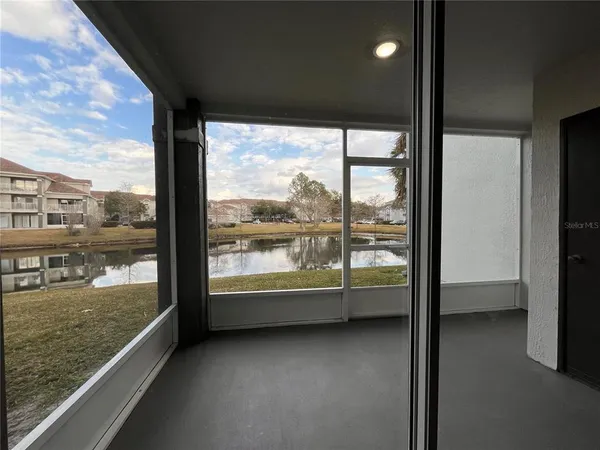 a view of an empty room with a large window