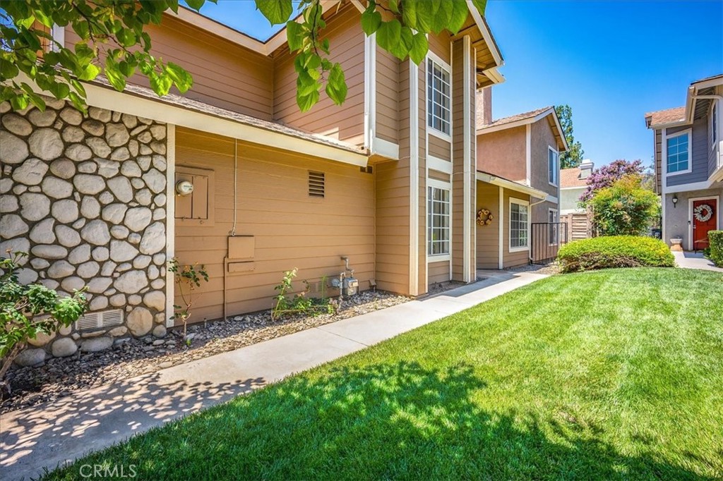 a backyard of a house with lots of green space