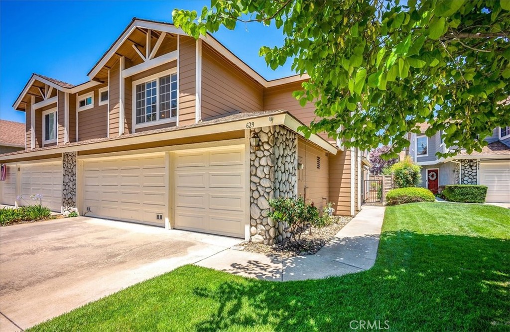 629 Calaveras Road San Dimas, CA 91773 - Photo 2 of 49 a front view of a house with a yard