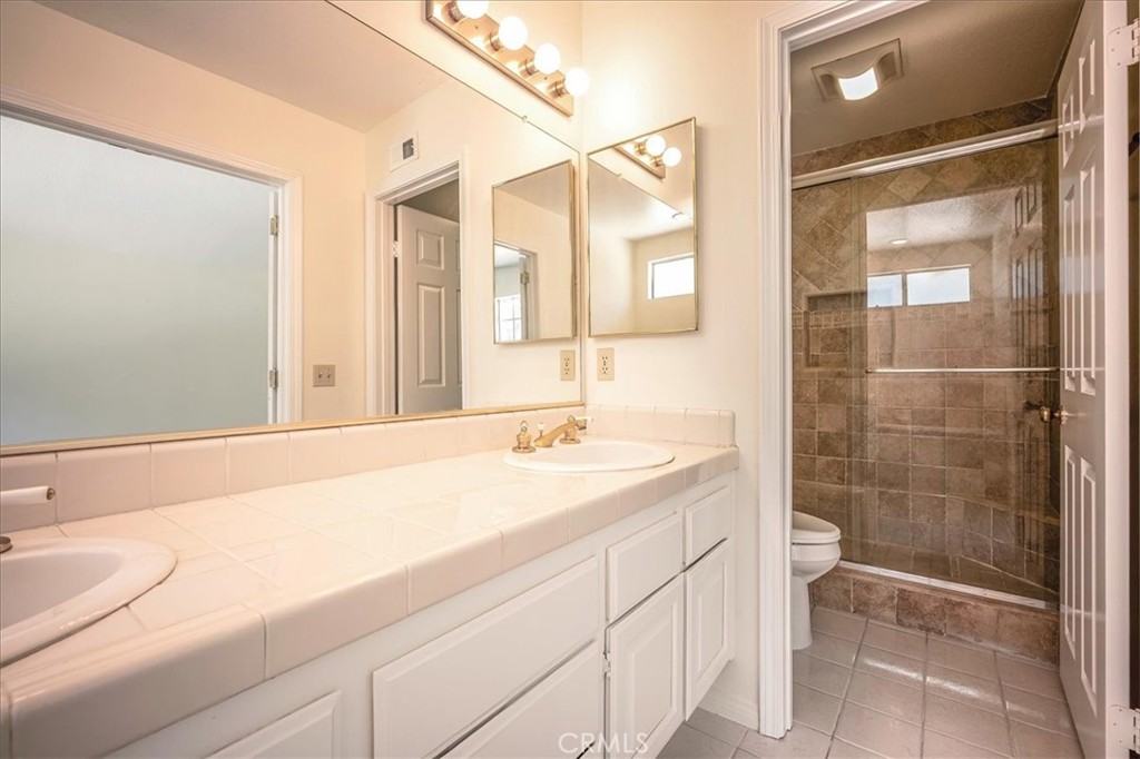 629 Calaveras Road San Dimas, CA 91773 - Photo 26 of 49 a bathroom with a sink and a mirror