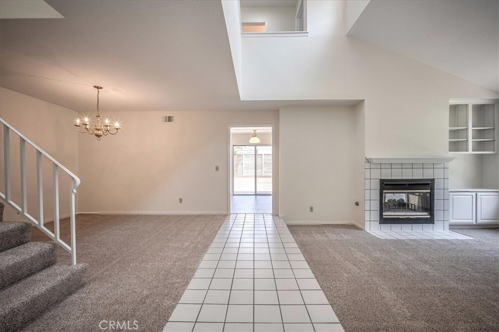 629 Calaveras Road San Dimas, CA 91773 - Photo 7 of 49 an empty room with windows and fireplace