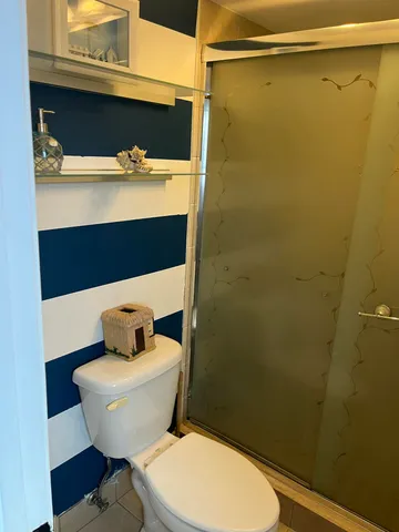 a bathroom with a toilet and a sink