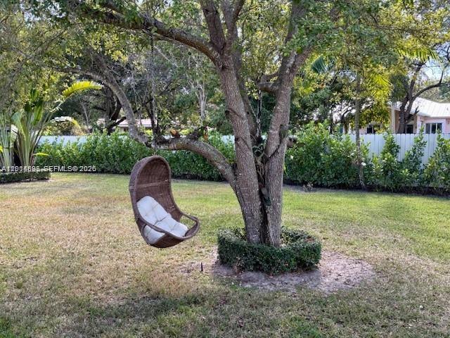 7830 Southwest 117th Street Pinecrest, FL 33156 - Photo 22 of 24 a view of a garden with a tree