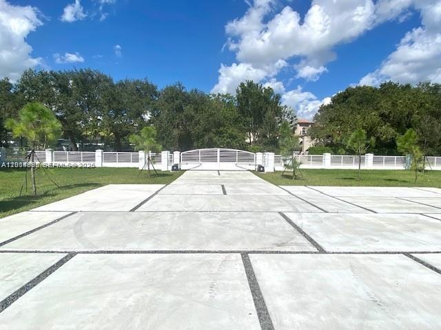 7830 Southwest 117th Street Pinecrest, FL 33156 - Photo 3 of 24 a view of a yard with a swimming pool