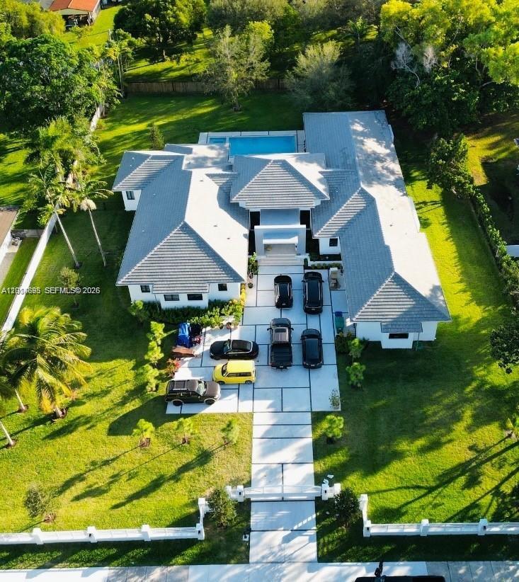7830 Southwest 117th Street Pinecrest, FL 33156 - Photo 4 of 24 an aerial view of house with yard swimming pool and outdoor seating