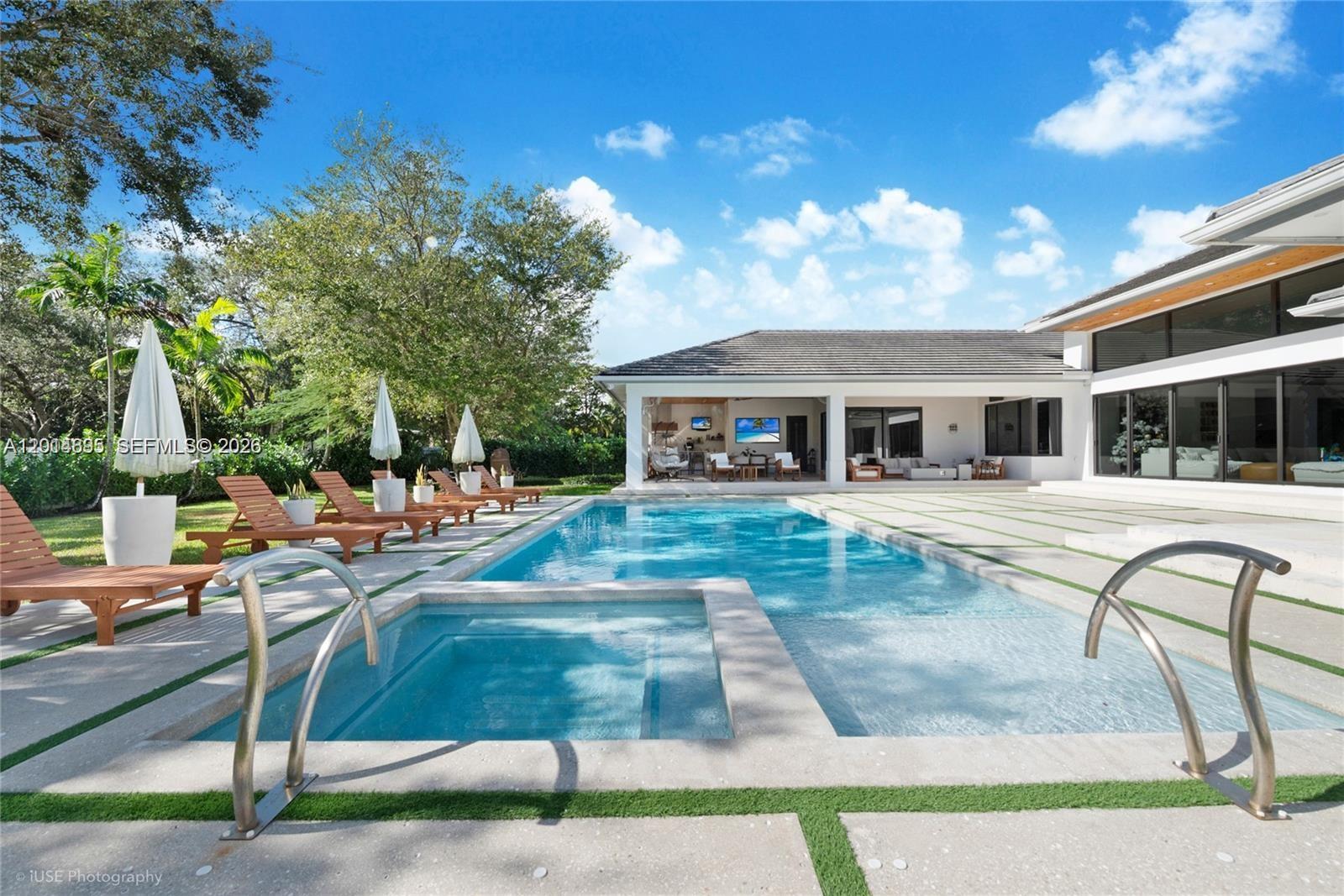 7830 Southwest 117th Street Pinecrest, FL 33156 - Photo 5 of 24 a view of a house with swimming pool