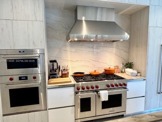 7830 Southwest 117th Street Pinecrest, FL 33156 - Photo 9 of 24 a stove top oven sitting inside of a kitchen