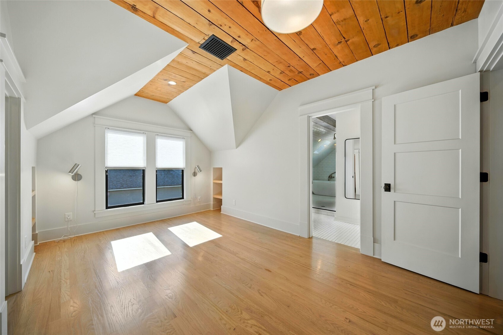 531 Newell Street Walla Walla, WA 99362 - Photo 20 of 38 a view of an empty room with wooden floor and a window