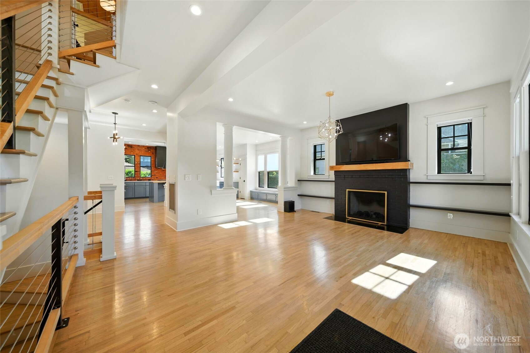 531 Newell Street Walla Walla, WA 99362 - Photo 9 of 38 a living room with furniture and a fireplace with wooden floor