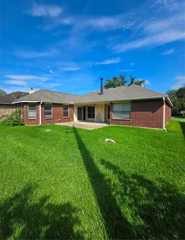 a view of a house with a big yard
