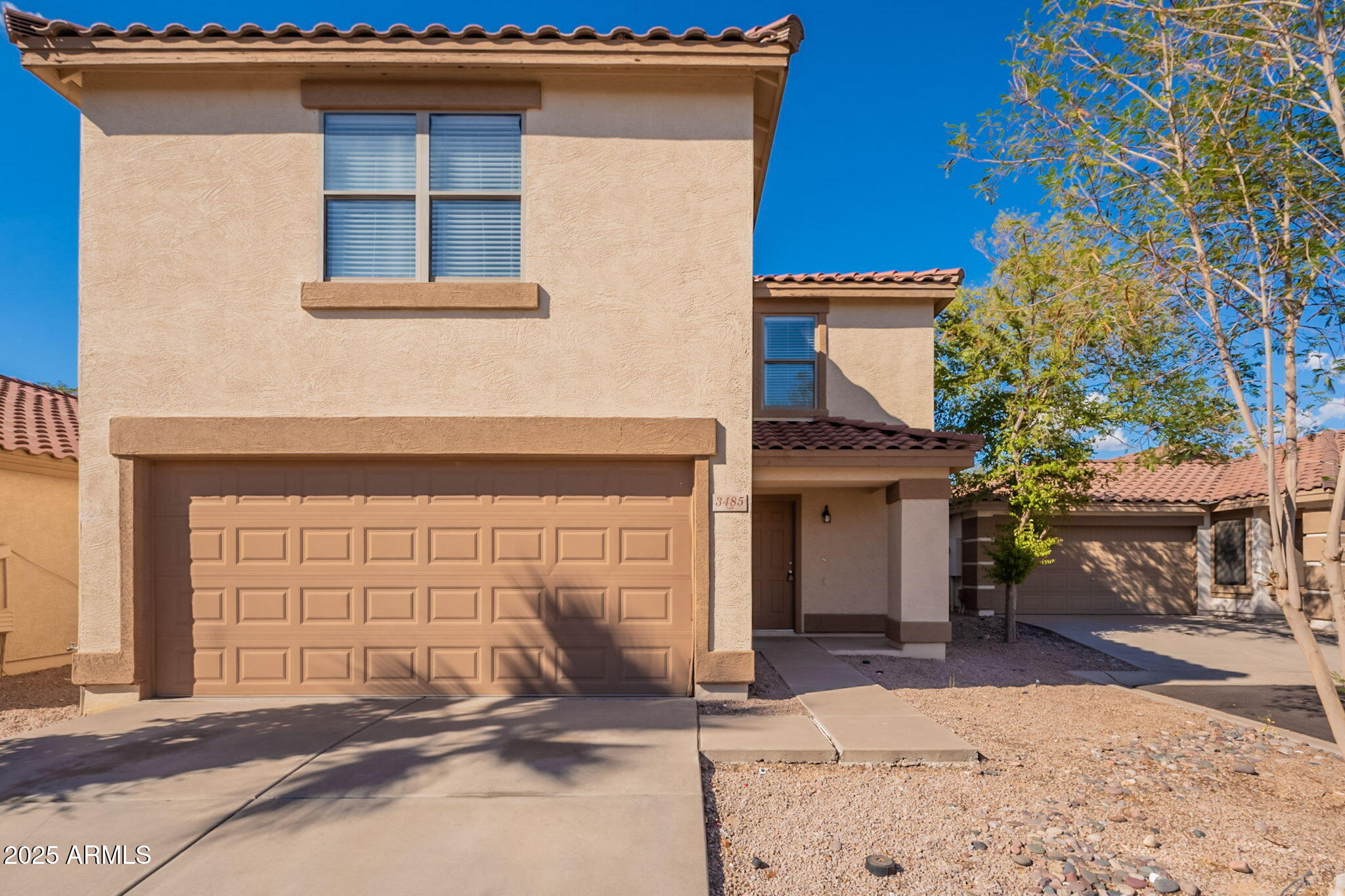 3485 South Bowman Road Apache Junction, AZ 85119 - Photo 2 of 46 a front view of a house with a garage