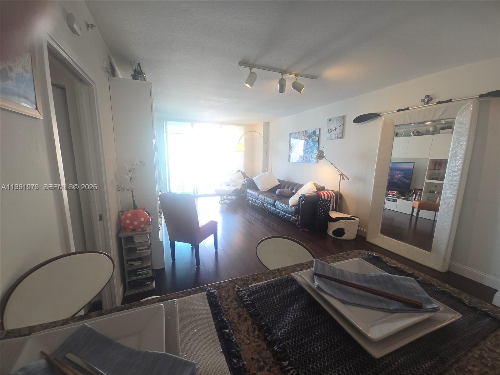 335 South Biscayne Boulevard, Unit 3400 Miami, FL 33131 - Photo 13 of 52 a living room with furniture
